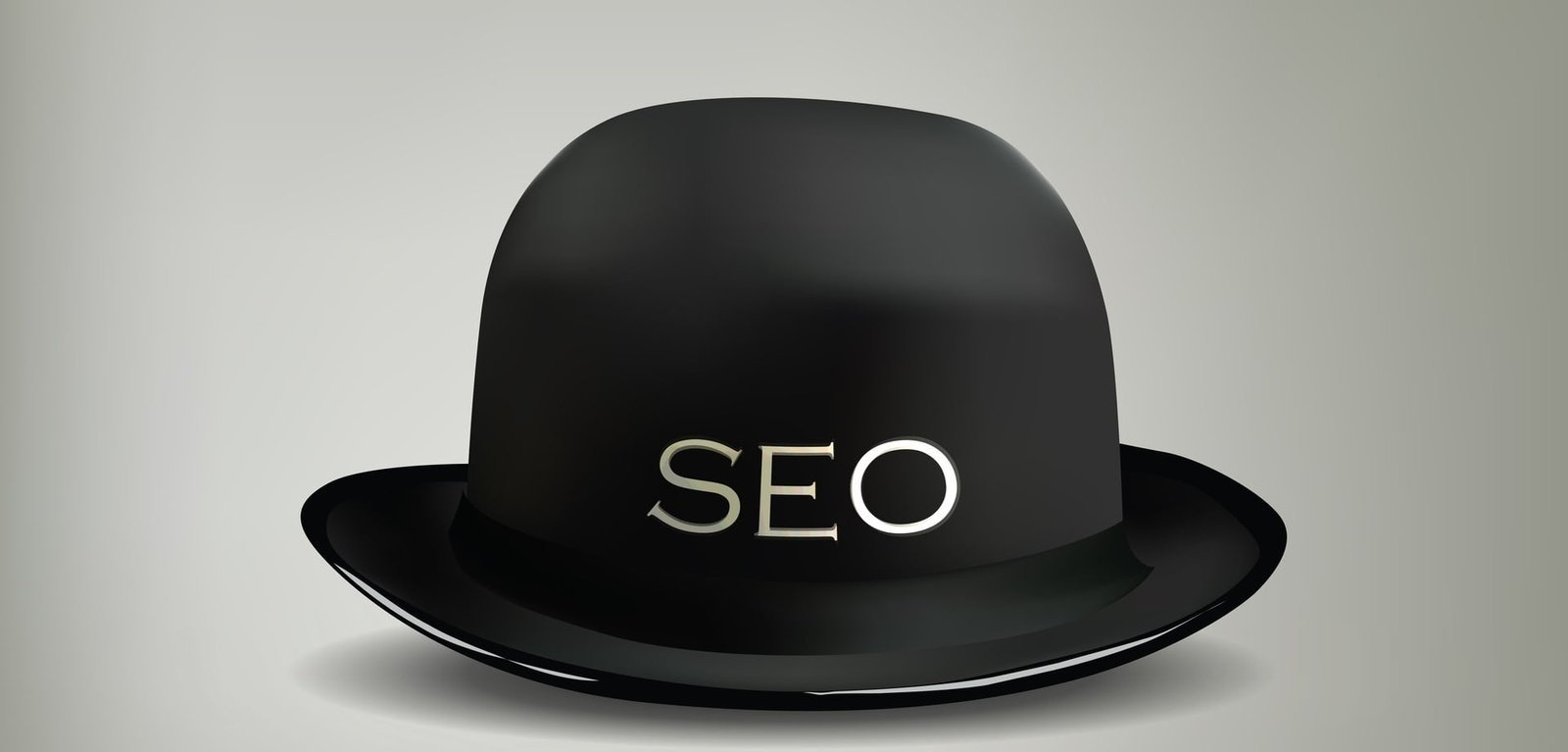 Een zwarte hoed versierd met het strategisch geplaatste woord seo.